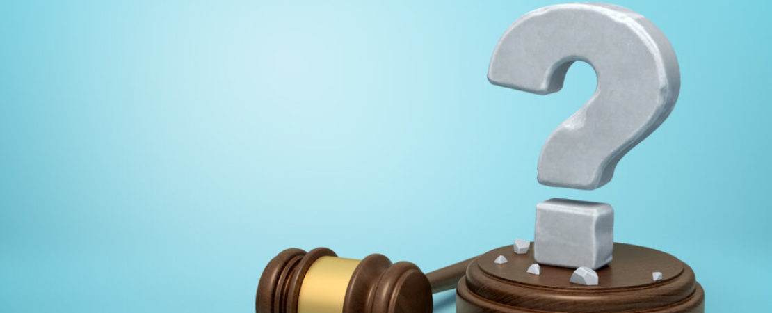 3d rendering of hefty stone question mark standing on sounding block with gavel beside on light-blue background with copy space.